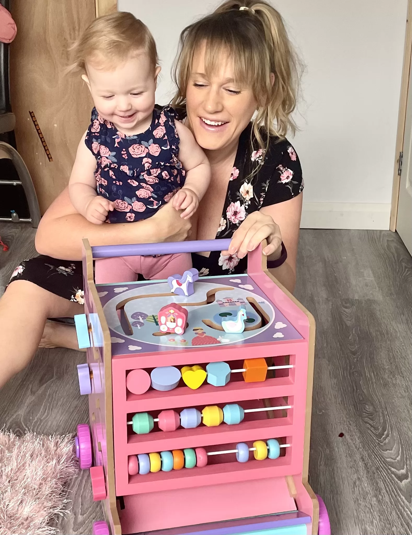 Toddler and mummy with activity learning cart